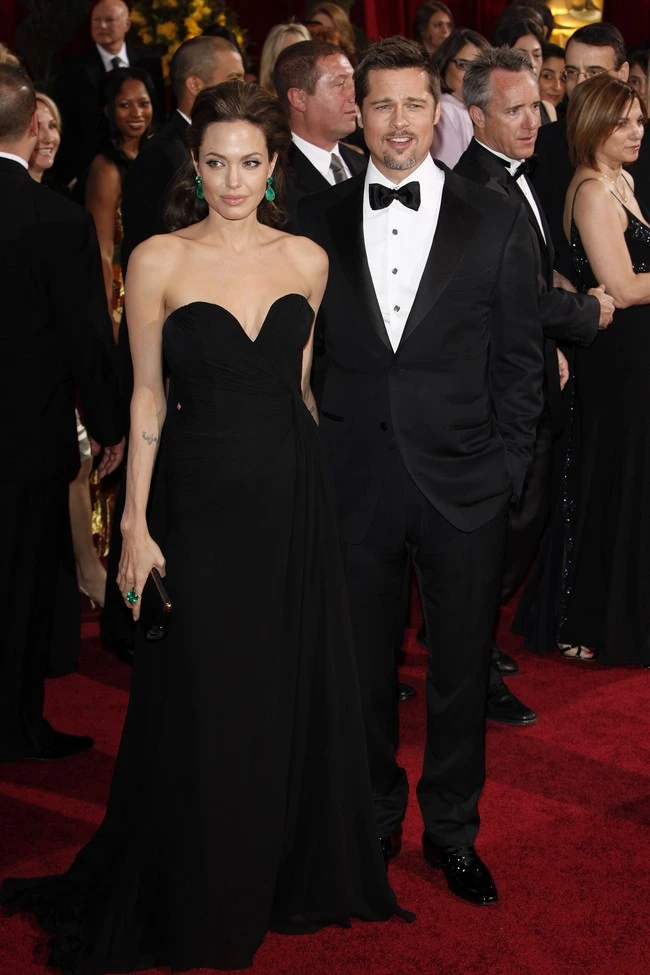 Angelina Jolie and Brad Pitt rule on the red carpet as they arrive for the Oscars. Angelina wore an Elie Saab gown, Lorraine Schwartz jewelry, Ferragamo shoes and a Lana Marks bag. Brad was decked out with a classic Tom Ford tux and David Yurman ring, cufflinks, and shirt studs. Pictured: Brad Pitt and Angelina Jolie Ref: SPL82600 220209 Picture by: Ciao Hollywood / Splash News Splash News and Pictures Los Angeles: 310-821-2666 New York: 212-619-2666 London: 870-934-2666 photodesk@splashnews.com 