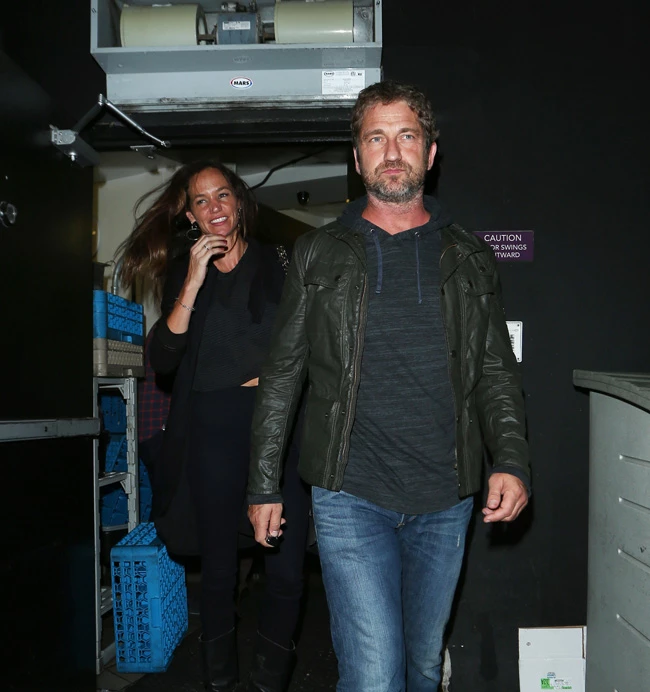 Gerard Butler and girlfriend Morgan Brown party at The Nice Guy Club in West Hollywood Pictured: Gerard Butler And Morgan Brown Ref: SPL1082623  190715   Picture by: Photographer Group / Splash News Splash News and Pictures Los Angeles:	310-821-2666 New York:	212-619-2666 London:	870-934-2666 photodesk@splashnews.com 