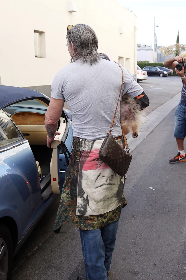 Mickey Rourke walking to his car with his puppy in Beverly Hills, CA Pictured: Mickey Rourke Ref: SPL1372843 121116 Picture by: Splash News Splash News and Pictures Los Angeles: 310-821-2666 New York: 212-619-2666 London: 870-934-2666 photodesk@splashnews.com 
