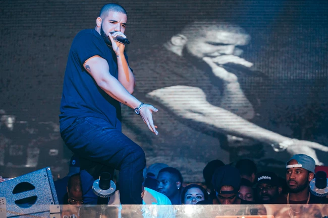 Drake and Rhianna were seen partying at a Miami strip club on Tuesday night. The pair were seen cozying up at E11even, which hosted an after party following Drake's concert at the American Airlines arena. The loved up couple were joined by a number of celebrity pals including Lil Wayne, Flo Rida, Dj Irie and Future. Drake also jumped on stage a sang a number of his hits for a crowd of fans.  Pictured: Drake performs at E11even Ref: SPL1343209  310816   Picture by: ADINAYEV / Splash News  Splash News and Pictures Los Angeles:	310-821-2666 New York:	212-619-2666 London:	870-934-2666 photodesk@splashnews.com 