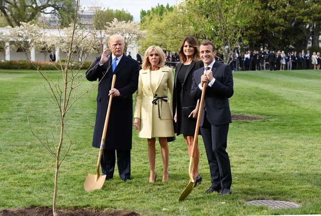 U.S President Donald Trump and First Lady Melania Trump join French President Emmanuel Macron and his wife Brigitte Macron
